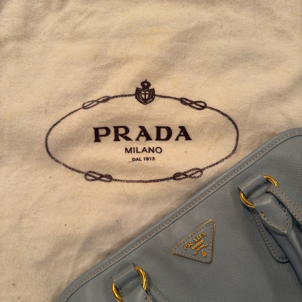 Prada Light Blue and Gold Tag